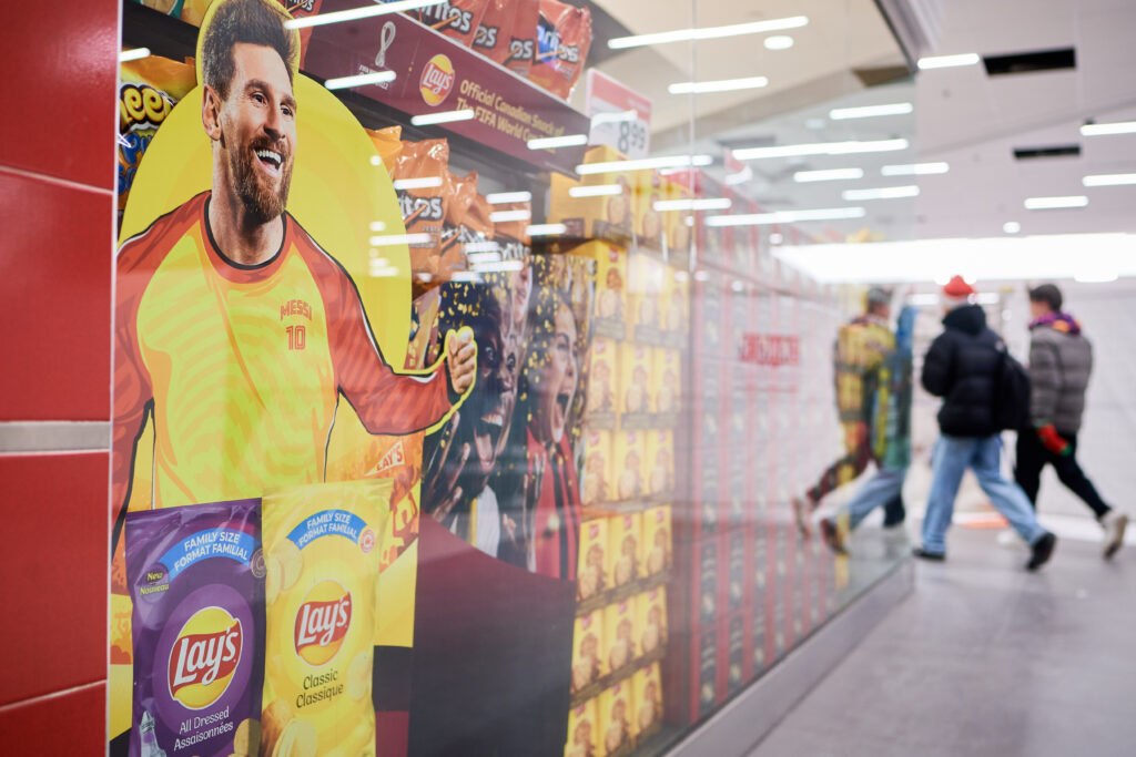 Advertisement of soccer player with bags of chips