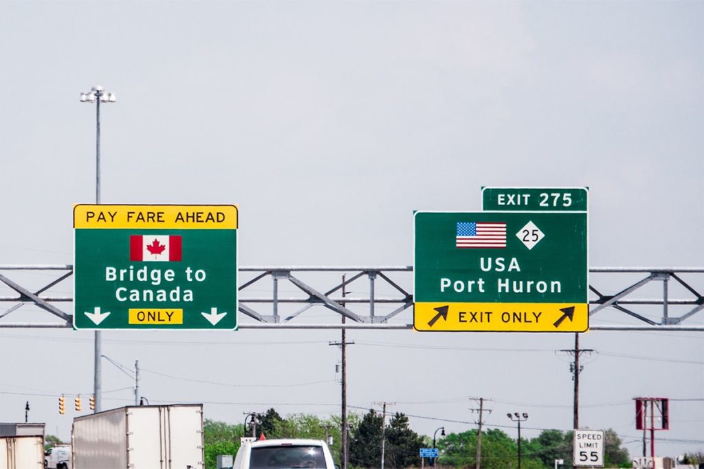 Canada-U.S. Border: Sarnia Border Crossing and Port Huron. Bridge to Canada on left of image and exit to U.S. Port Huron on the right of image. 