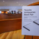 A sign in the lobby of the Art Gallery of Ontario directs attendees to the Toronto Antiquarian Book Fair.