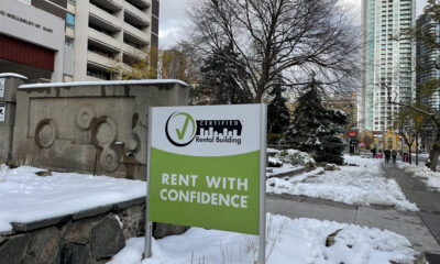Green rental sign in the snow.