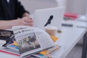 Laptop with New York Times newspaper